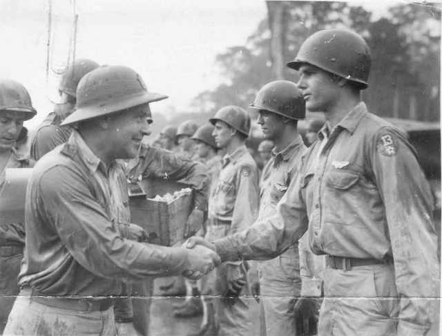 Brig. Gen. Earl W. Barnes awards Air Medal to Sgt. Wayne A. Gray, Mar Air Field, Sansapor, New Guinea